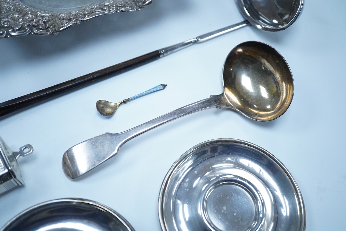 A small group of silver to include an Elizabeth II pierced shallow dish by Viners Ltd, Sheffield, 1957, diameter 12.4cm, a 1930's silver mounted cigarette box, a George III silver fiddle pattern sauce ladle and five silv